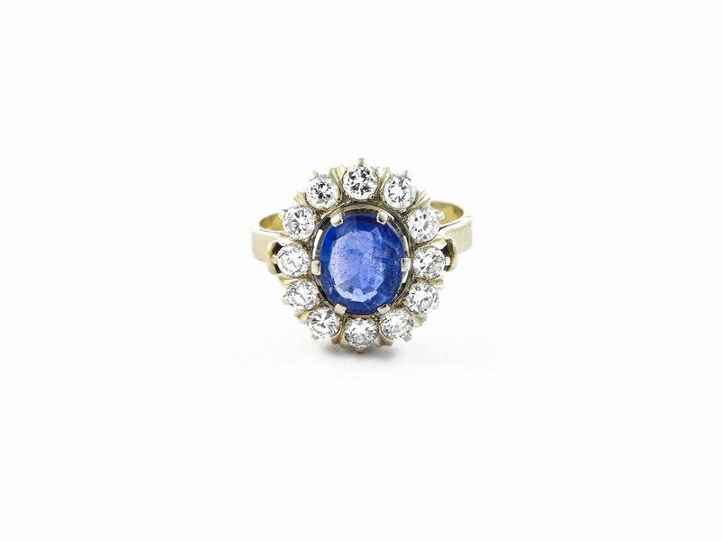 Anello in Oro Bianco con Diamanti e Zaffiro