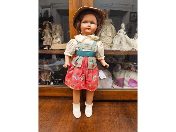 Doll in composition in Tyrolean clothes