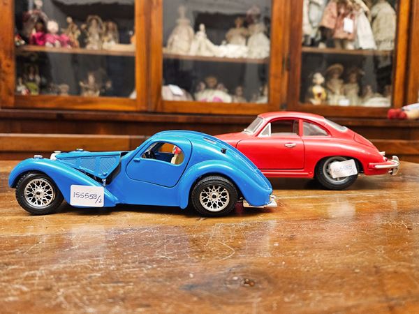 Two vintage Burago model cars