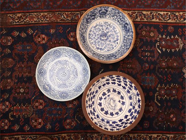 Three earthenware plates