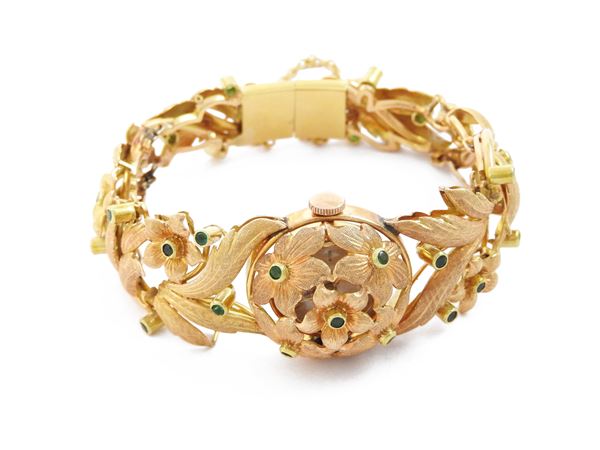 Yellow gold Girard Perregaux watch bracelet with emeralds