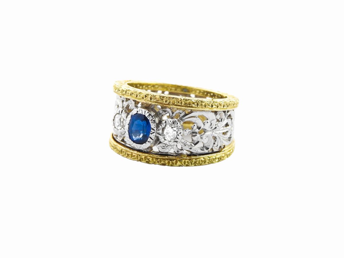 Anello a Fascia in Oro Bianco e Giallo con Diamanti e Zaffiro