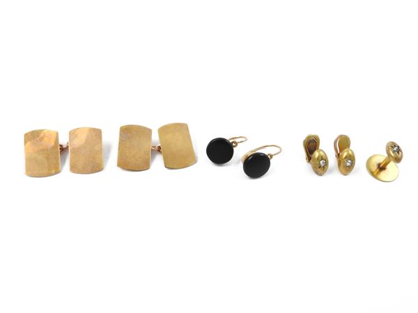 A pair of earrings, a pair of cufflinks and a pair of low title gold firing buttons