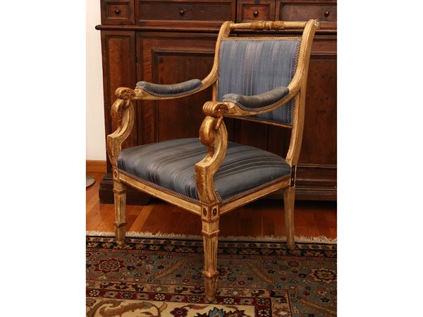 Pair of armchairs in ivory lacquered wood highlighted in gold
