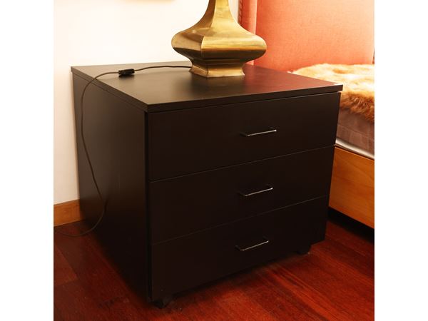 Low chest of drawers in black laminate