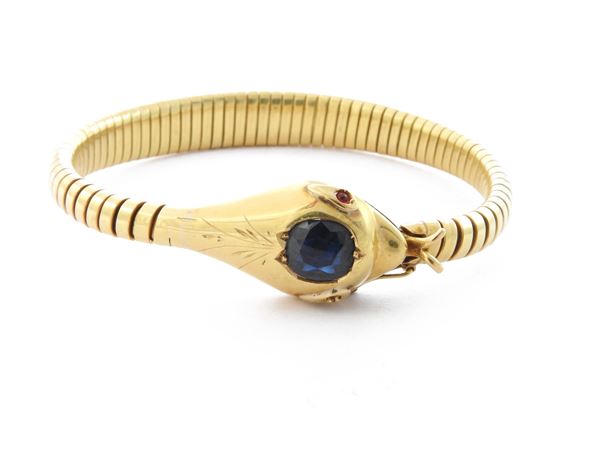 Yellow gold tubogas animalier bracelet with sapphire and rubies