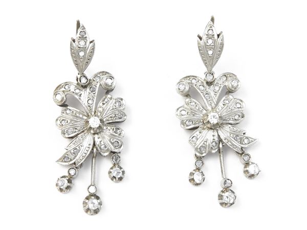 White gold pendant earrings with diamonds
