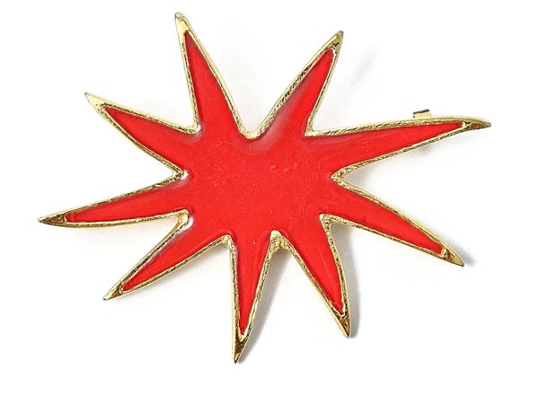 Large star-shaped red enamel brooch
