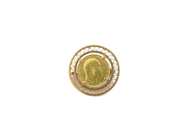 Yellow gold brooch with one pound coin