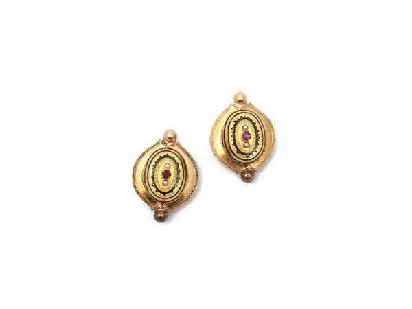 Pair of yellow gold brooches with black enamel, micropearls and red gems