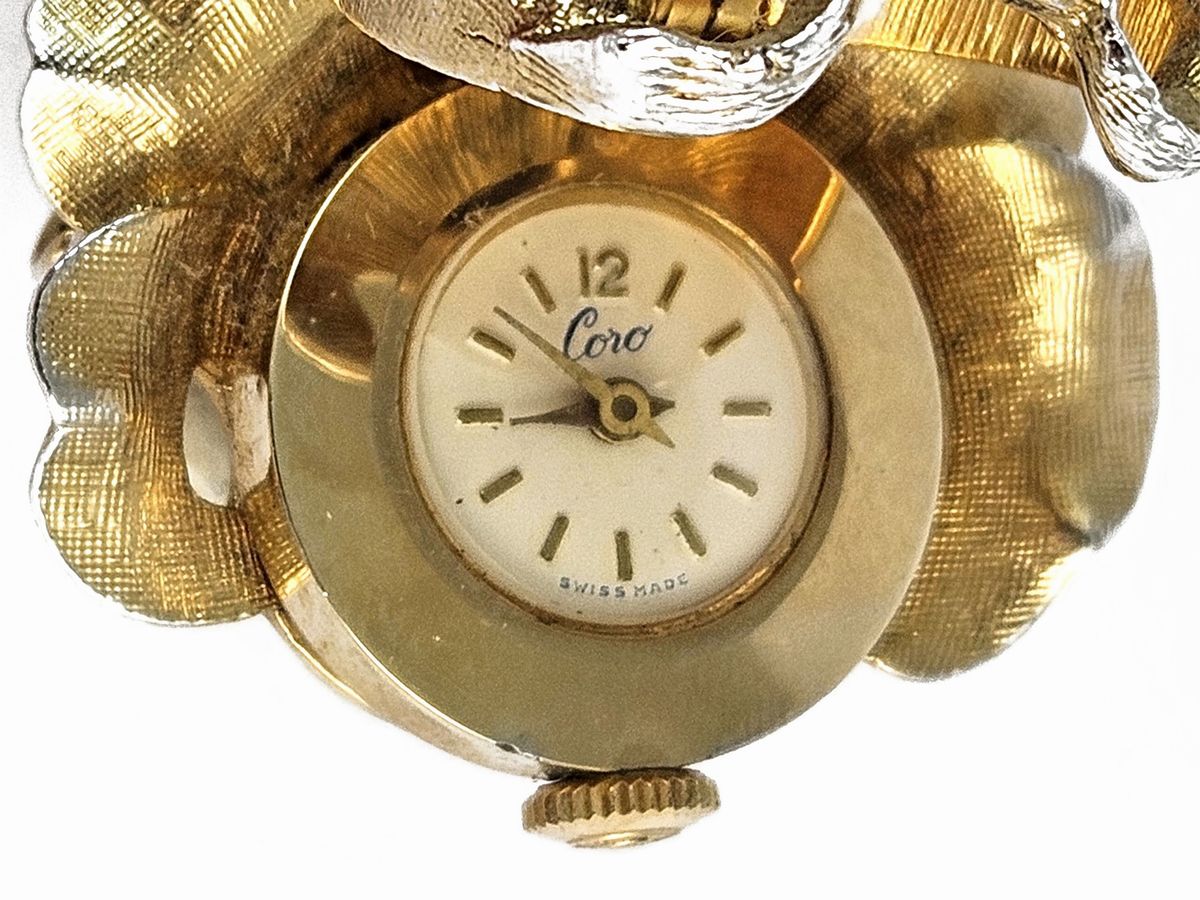Coro, Spilla/orologio