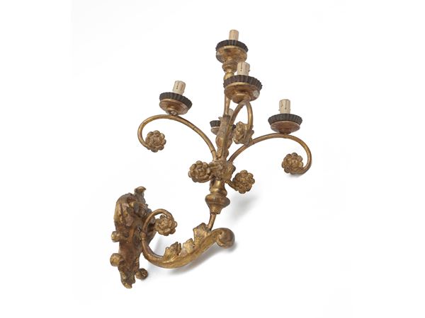 Pair of sconces in carved and gilded wood and metal