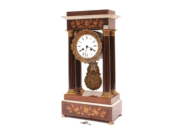 Temple clock veneered in walnut and other essences
