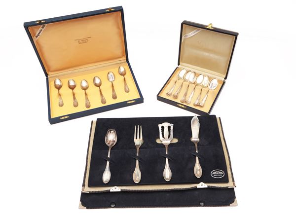 Three sets of silver cutlery
