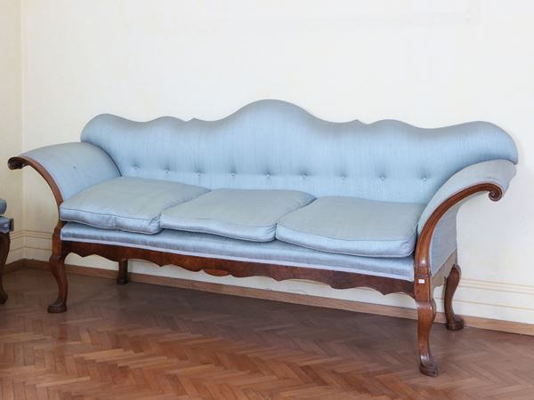 Fan-shaped sofa in walnut