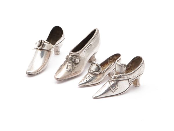 Four silver lucky shoes