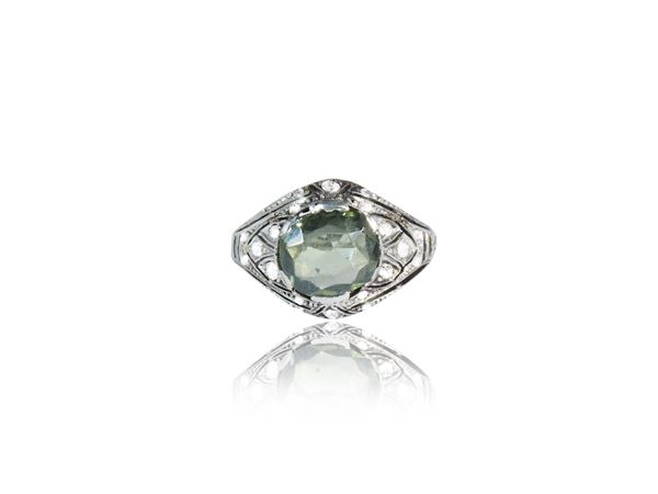 White gold ring with diamonds and green tourmaline