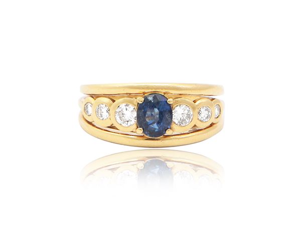 Riviere ring in yellow gold with diamonds and sapphire
