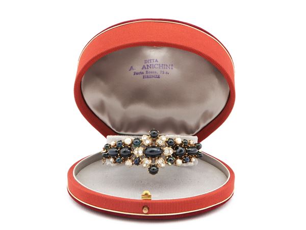 Yellow gold bangle with diamonds, sapphires and pearls