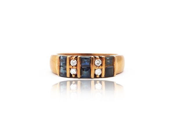 14Kt yellow gold riviere ring with diamonds and sapphires