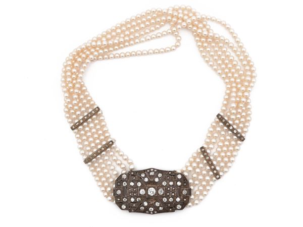 Multi-strand necklace with silver, diamonds and cultured pearls clasp and elements
