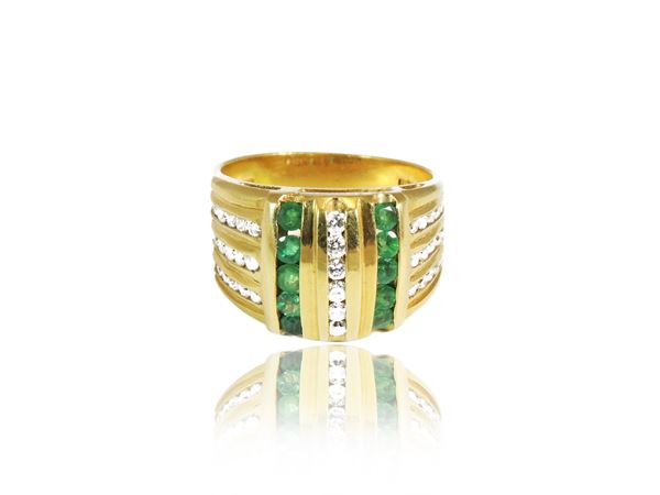 Yellow gold band ring with diamonds and emeralds