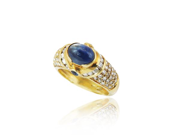 Yellow gold ring with diamonds and sapphires