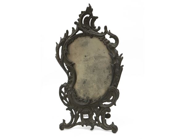 Toilet mirror with metal frame