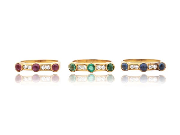 Three yellow gold rings with diamonds, rubies, sapphires and emeralds
