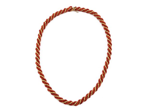 Yellow gold necklace with orange-red coral