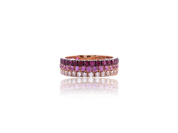 Pink gold ring with diamonds, rubies and pink corundum