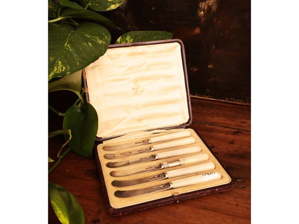 Set of six silver butter knives