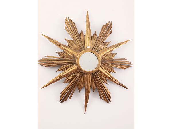 Carved and gilded wooden mirror