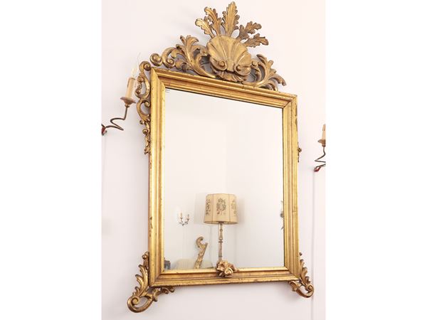 Carved and gilded wooden mirror