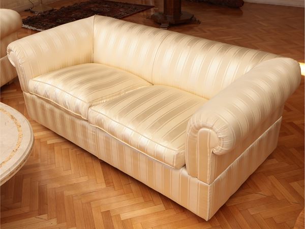 Shell sofa upholstered and covered in satin