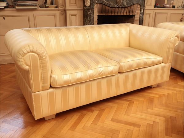 Shell sofa upholstered and covered in satin