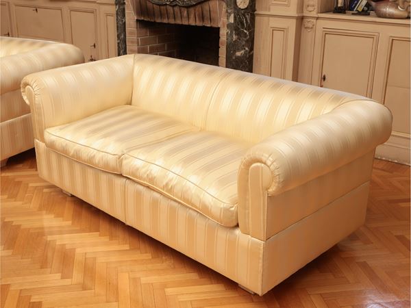 Shell sofa upholstered and covered in satin