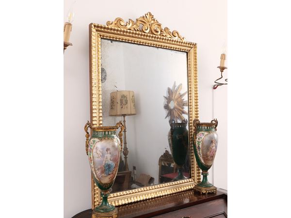 Carved and gilded wooden mirror