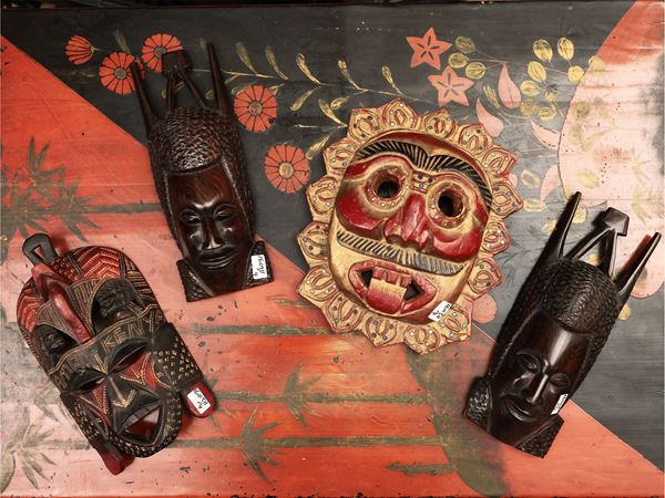 Four oriental wooden masks