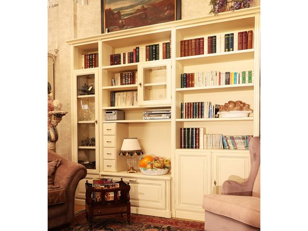 Bookcase in butter-coloured lacquered wood