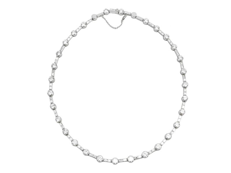 Importante collana rivière in oro bianco e diamanti