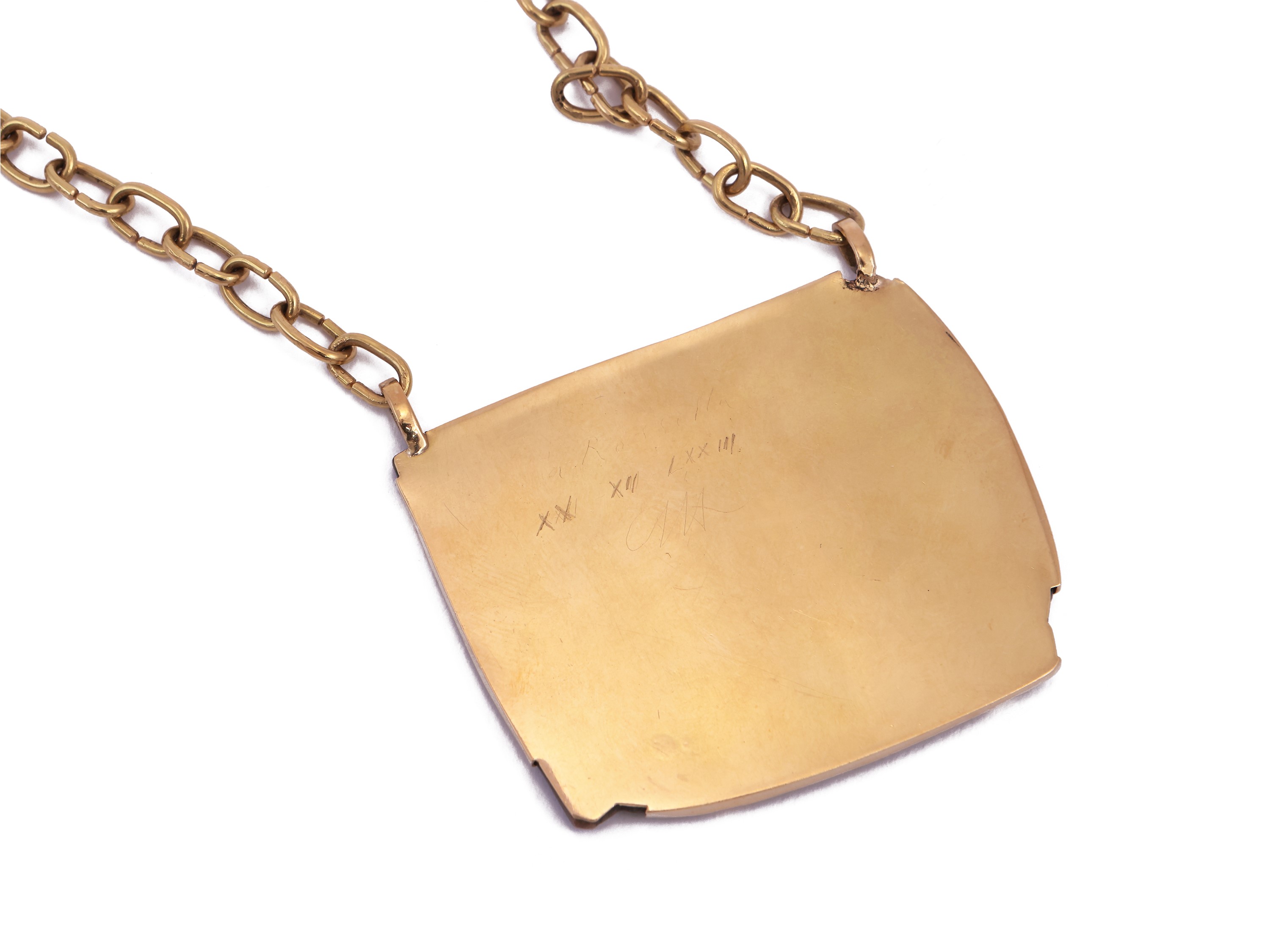 Placchetta a bassorilievo in bronzo, montata in oro giallo, 1973