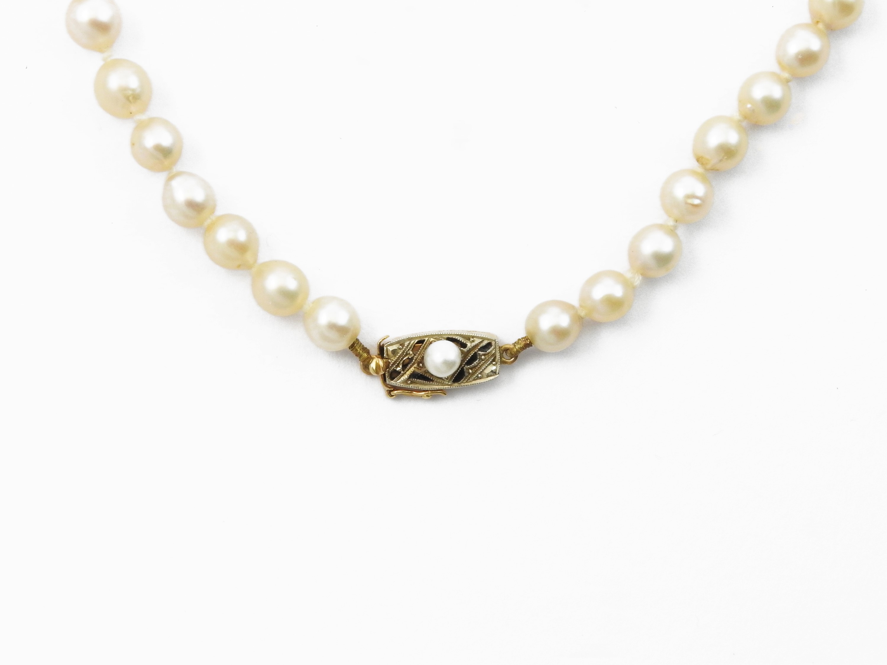 Collana degradè di perle coltivate con fermezza in oro giallo