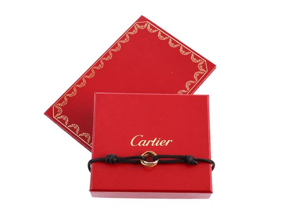 Cartier Trinity bracelet with three golds charm with cord bracelet