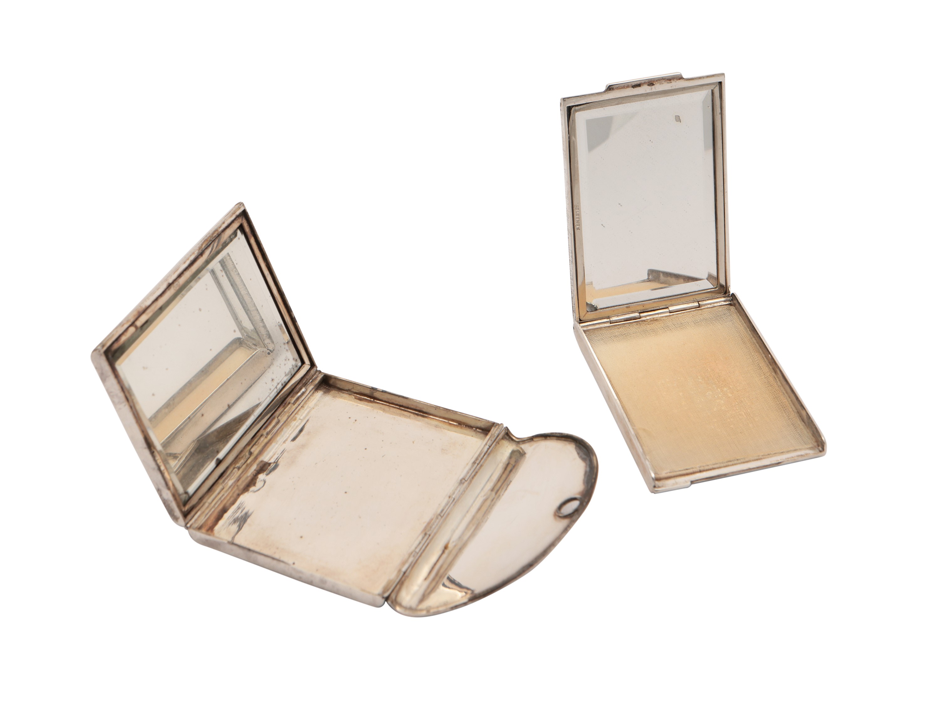 Due piccoli vanity set da borsetta in argento satinato
