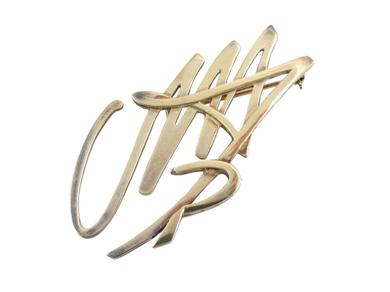 Pendente-spilla in argento dorato