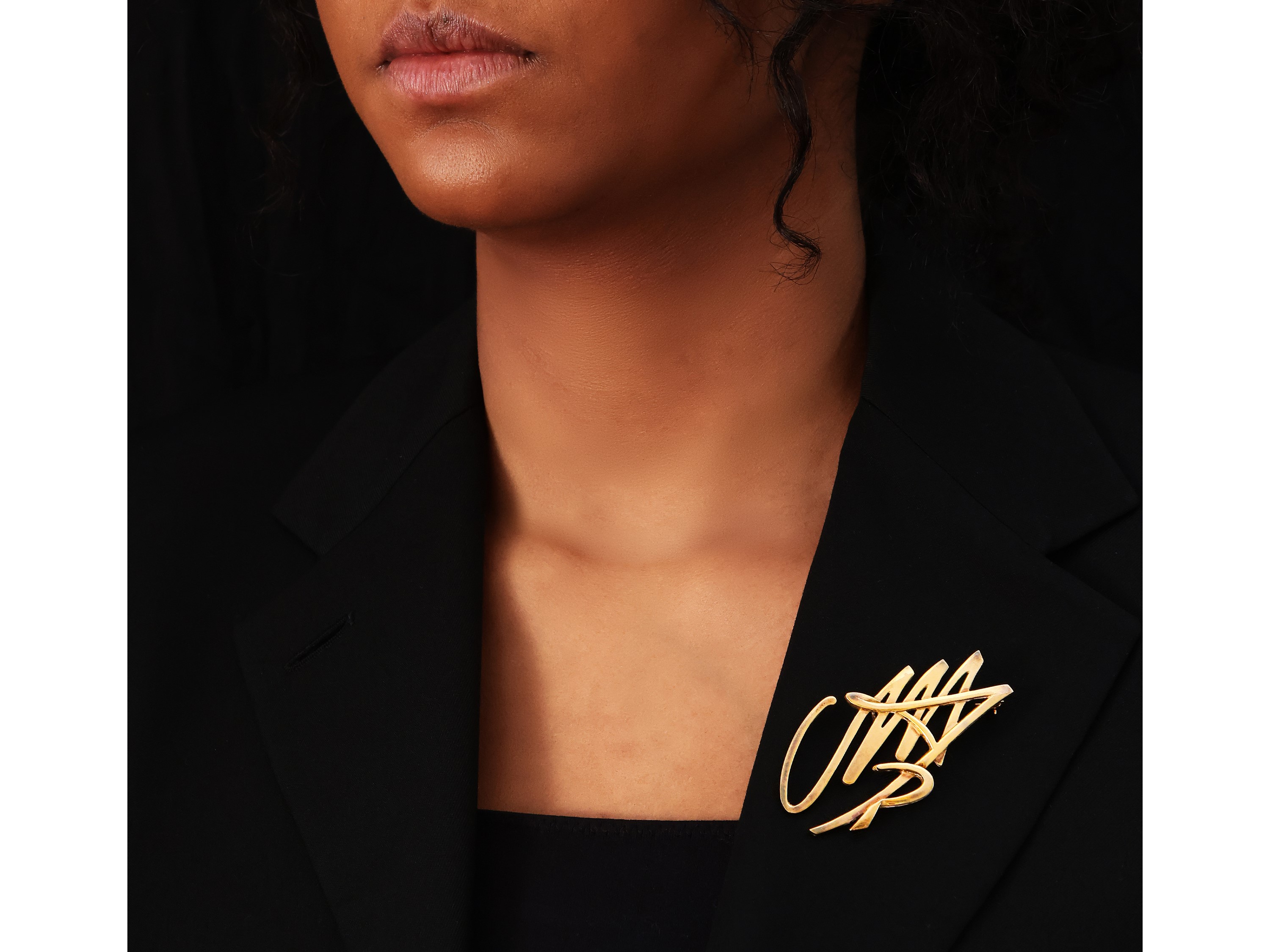 Pendente-spilla in argento dorato