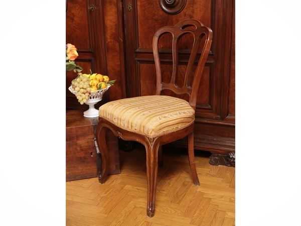 Series of four chairs in walnut