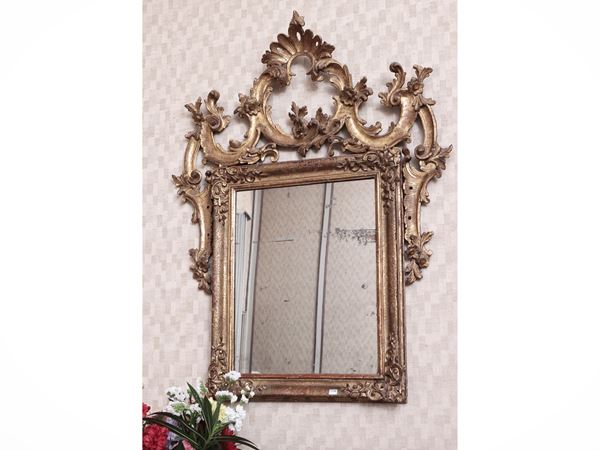 Mirror with carved and golden wooden frame in Mecca