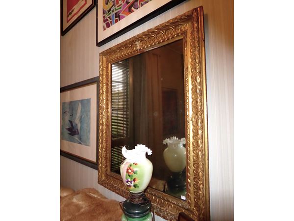 Carved and golden wooden frame